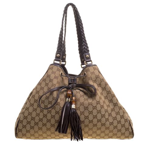 gucci small bag with braided botton and tassel